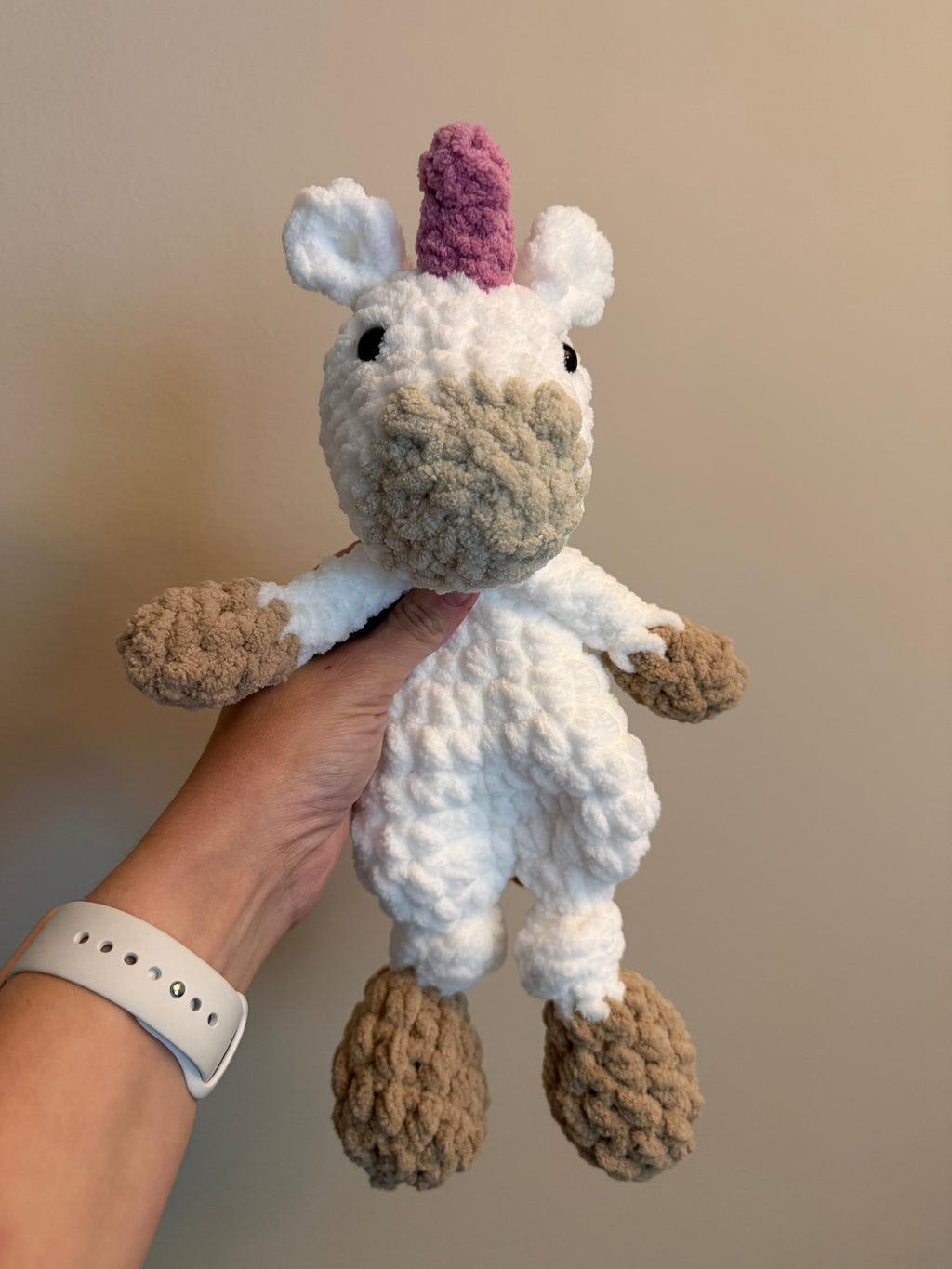 Handmade crochet unicorn snuggler