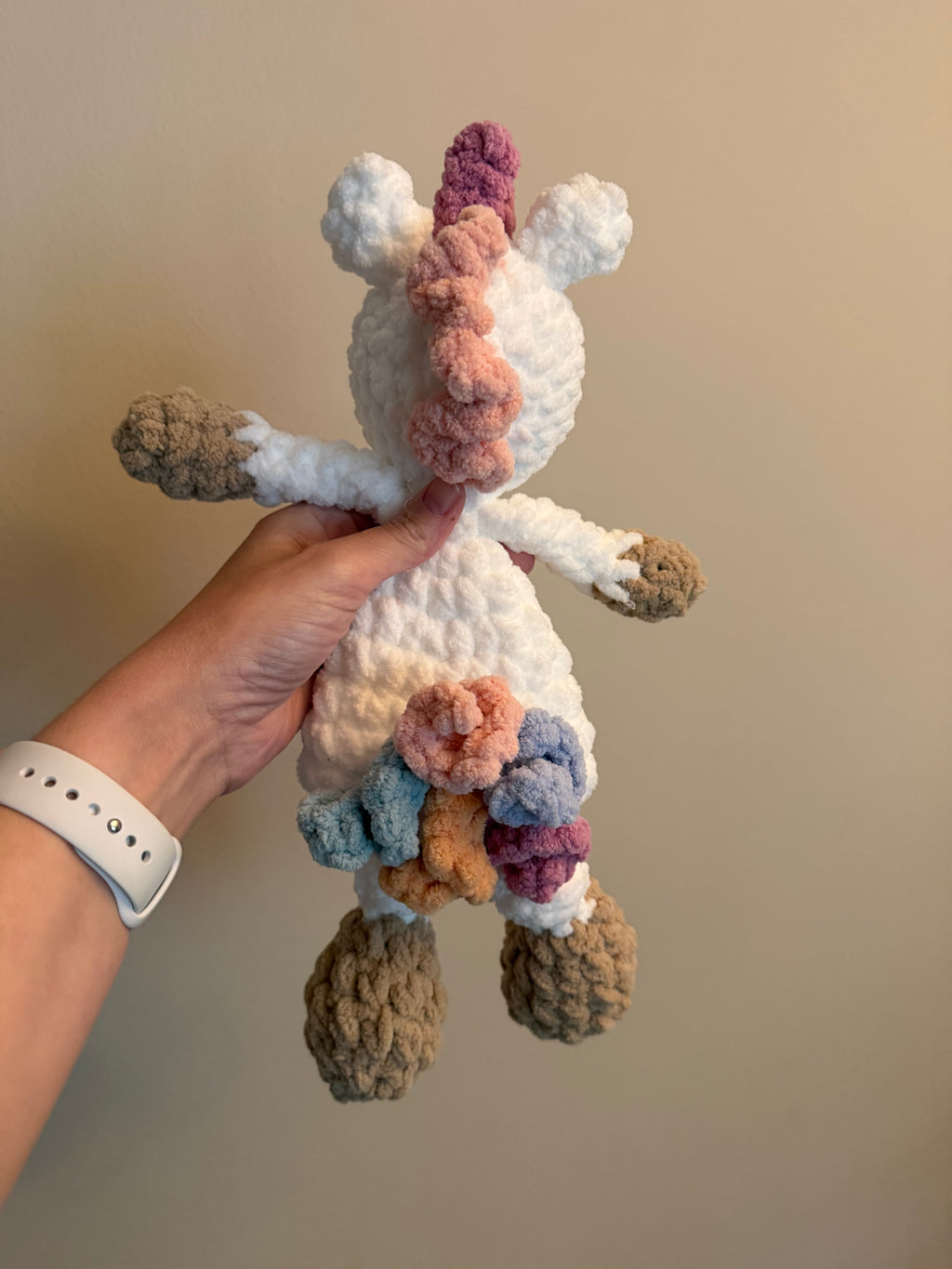 Handmade crochet unicorn snuggler