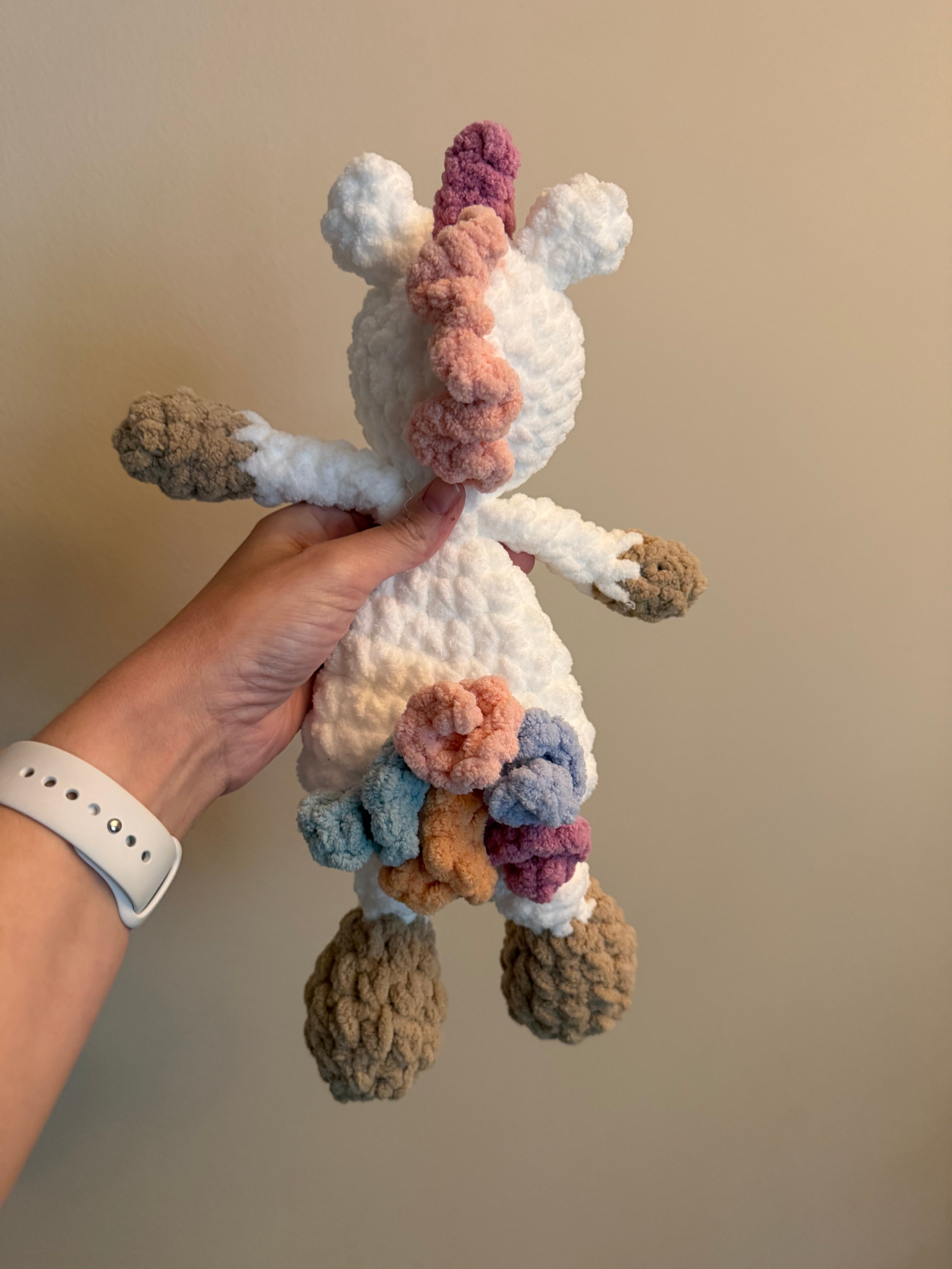 Handmade crochet unicorn snuggler